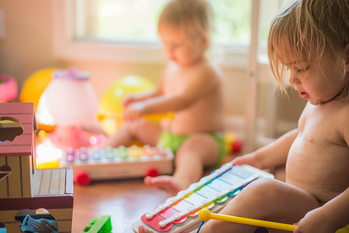 two children playing music